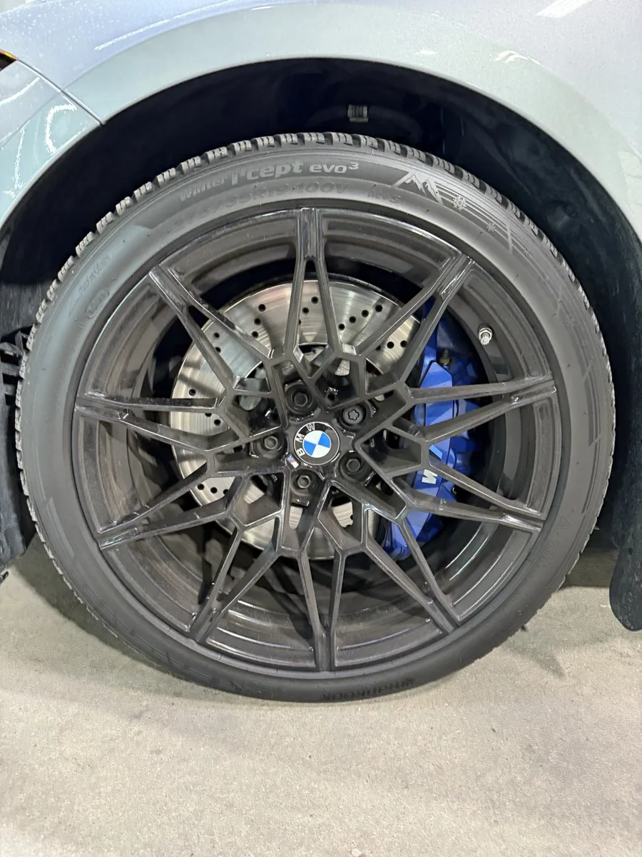 Gold powder-coated wheels on a BMW M3, refinished at AUTOSTREAM360
