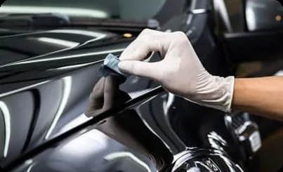Polishing pads on a hood during paint correction at AUTOSTREAM360