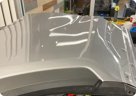 Hail dents on a body panel before paintless repair