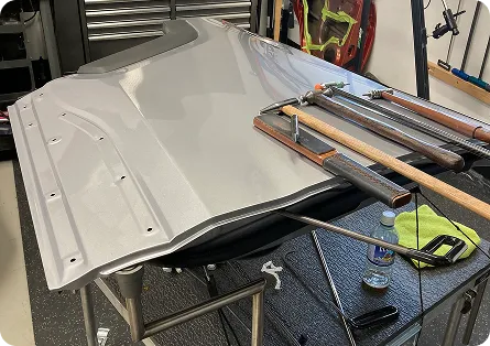 Dent visible under PDR inspection lighting